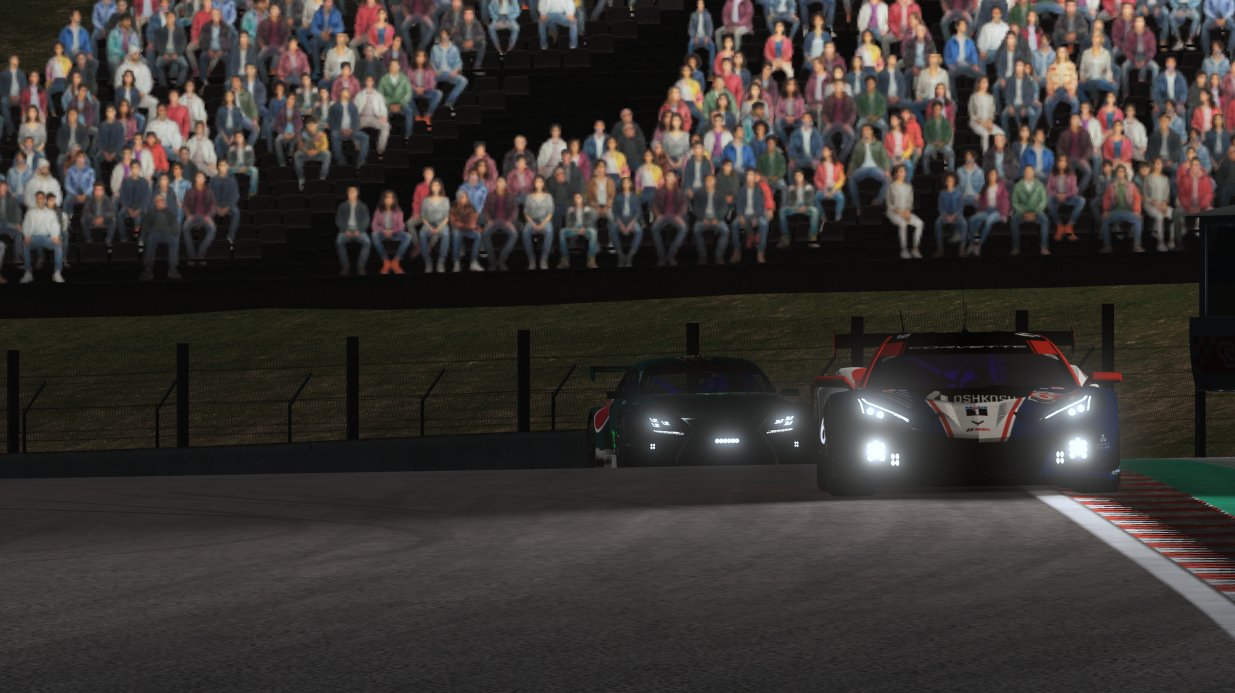 TRT cars racing through a night endurance session